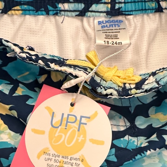 Ruffle Butts Blue and Yellow Fish Friends Swim Trunks - Picture 2 of 5